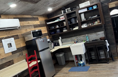 Pineville Cabin | The Ridge Adventure Center rustic pet friendly tiny cabin, outdoor shower stage