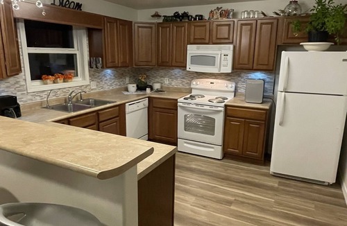 Coffeyville House | Trendy home with a scenic back porch, fish, golf pickle ball and more