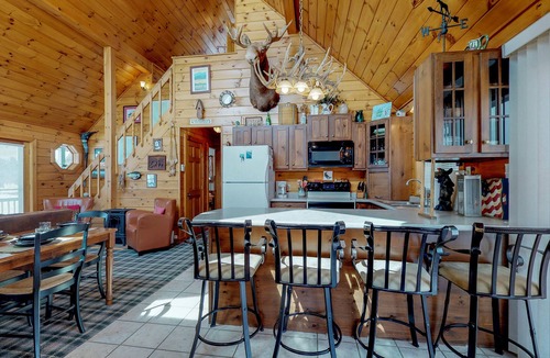 Greenville House | Two lakefront dog-friendly cabins on four acres with porches, dock, & lake views