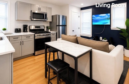 Corn Hill House | Unwind in this well-maintained unit with free parking, a fully stocked kitchen, and an in-suite washer/dryer. Perfect for work or leisure travel, this comfortable space has everything you need for a relaxing stay.