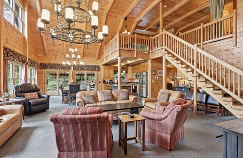 Perinton Cabin | Upscale log cabin w/20` ceilings, indoor hot tub & King beds