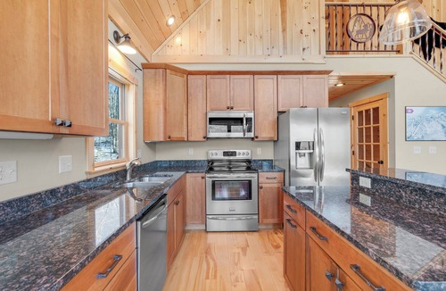 South Pond Shores Ski Chalet | Waterfront Chalet: 4BR Luxury w/Game Room, Private Dock & Minutes to Skiing!