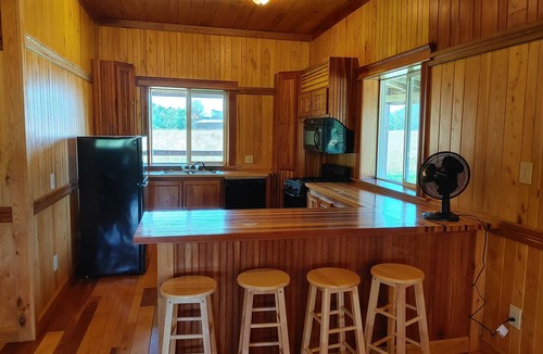 Gerry House | Woodys Retreat this rental includes the barn outdoor covered fire pit
