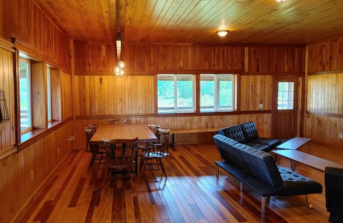 Gerry House | Woodys Retreat this rental includes the barn outdoor covered fire pit