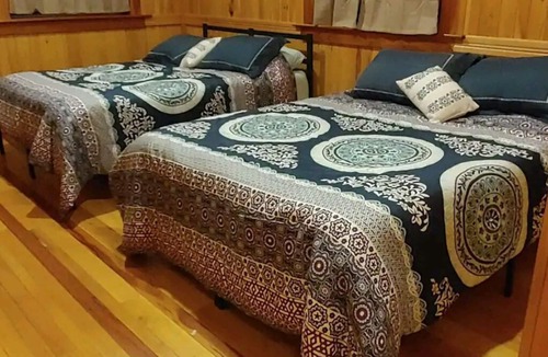 Gerry House | Woodys Retreat this rental includes the barn outdoor covered fire pit