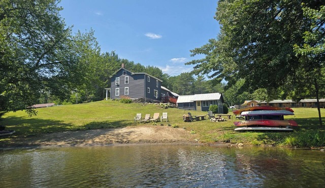 4 BR modern farmhouse with 173 ft of private lakefront on tranquil Loon Lake.