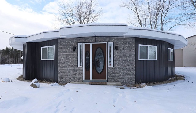 AVIATOR CIRCLE, A UNIQUE CIRCULAR HOME ON A QUIET AIRSTRIP IN FLUSHING, MI