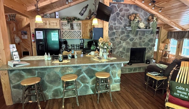 Beautiful 2 BR cabin with a wall of windows overlooking the deck and stream.