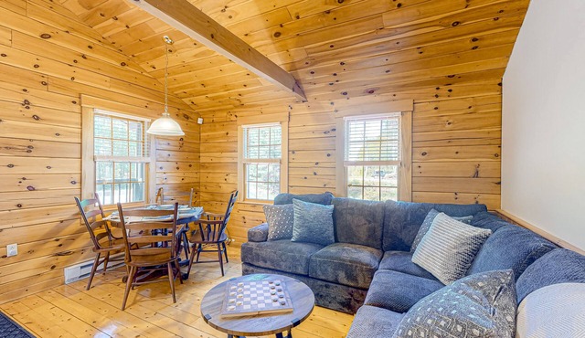 Charming log cabin with firepit, lovely interior, and cozy patio/deck