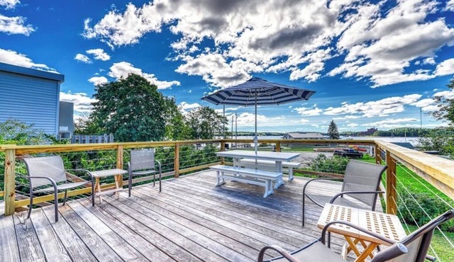 Elegant home right in town with gorgeous water view, deck & interior