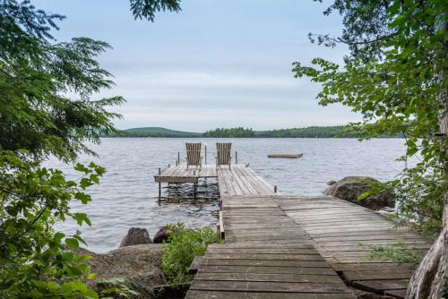 Gorgeous lakefront home w/dock, canoe, kayaks & lake/forest views