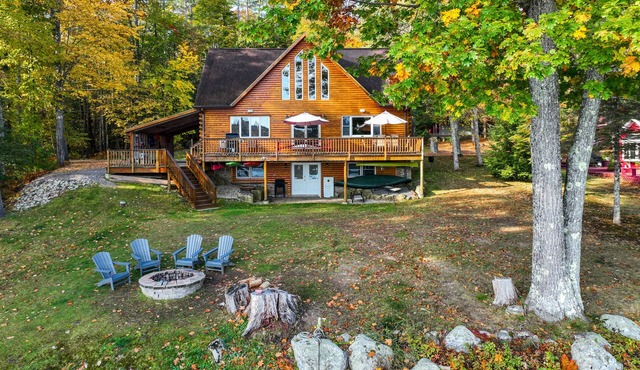 Lakefront, dog-friendly home with dock, kayaks, SUPs, canoe, huge deck & firepit