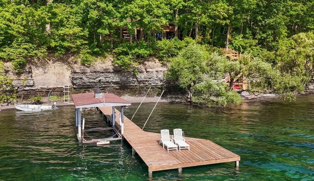 Lakefront Seneca Lake retreat with a private beach, dock, hot tub, and game room. Minutes from wineries and Watkins Glen. Pet friendly.