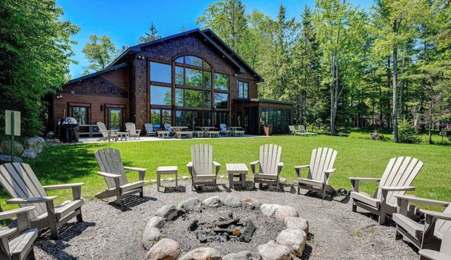 Luxury lakefront home with high-speed WiFi, dock, private beach, & theater room