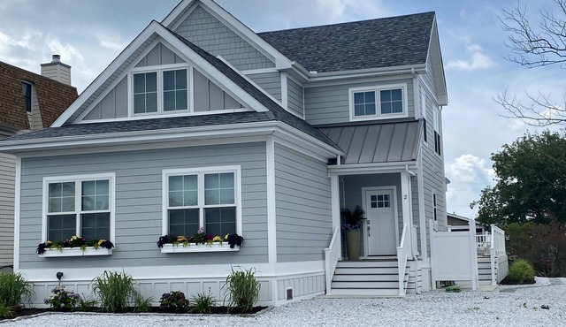 New 5 bedroom & 6 bathroom waterfront home on canal with pool close to beach!