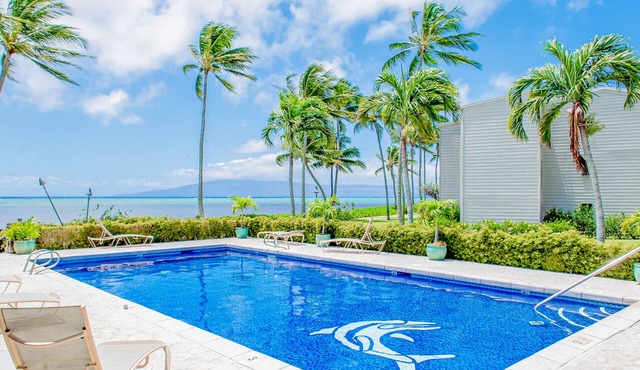 Ocean view condo with shaded lana'i, WiFi & shared pool, tennis, grills, cabana