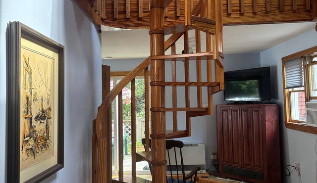 Unique apartment with intricate woodwork and spiral staircase. 5 miles to beach!