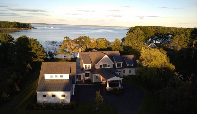 Waterfront estate near Portland with pool, dock and sweeping views of Casco Bay.